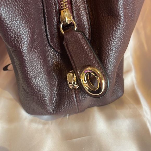 Coach Edie 31 Refined Pebble
Leather Shoulder Bag NWT in Oxblood w duster - Picture 7 of 9